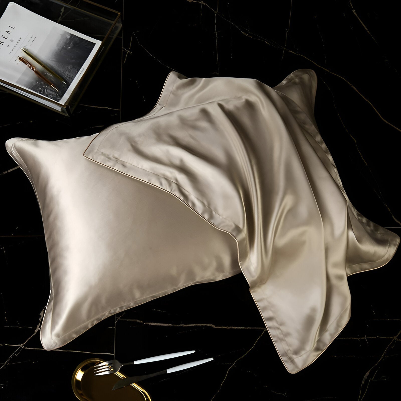 Amari Silk Lyocell Pillowcase - Close Up Of Pillowcases - Black Background - Champagne