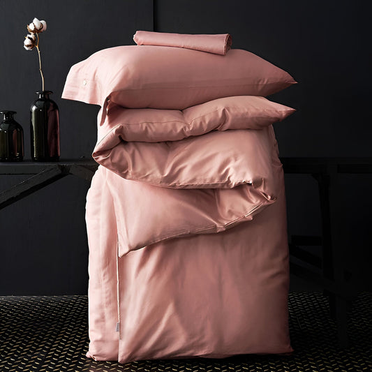 Kendall Egyptian Cotton Bedding Set - Duvet Cover And Pillowcases Neatly Packed On A Black Background - Coral Pink