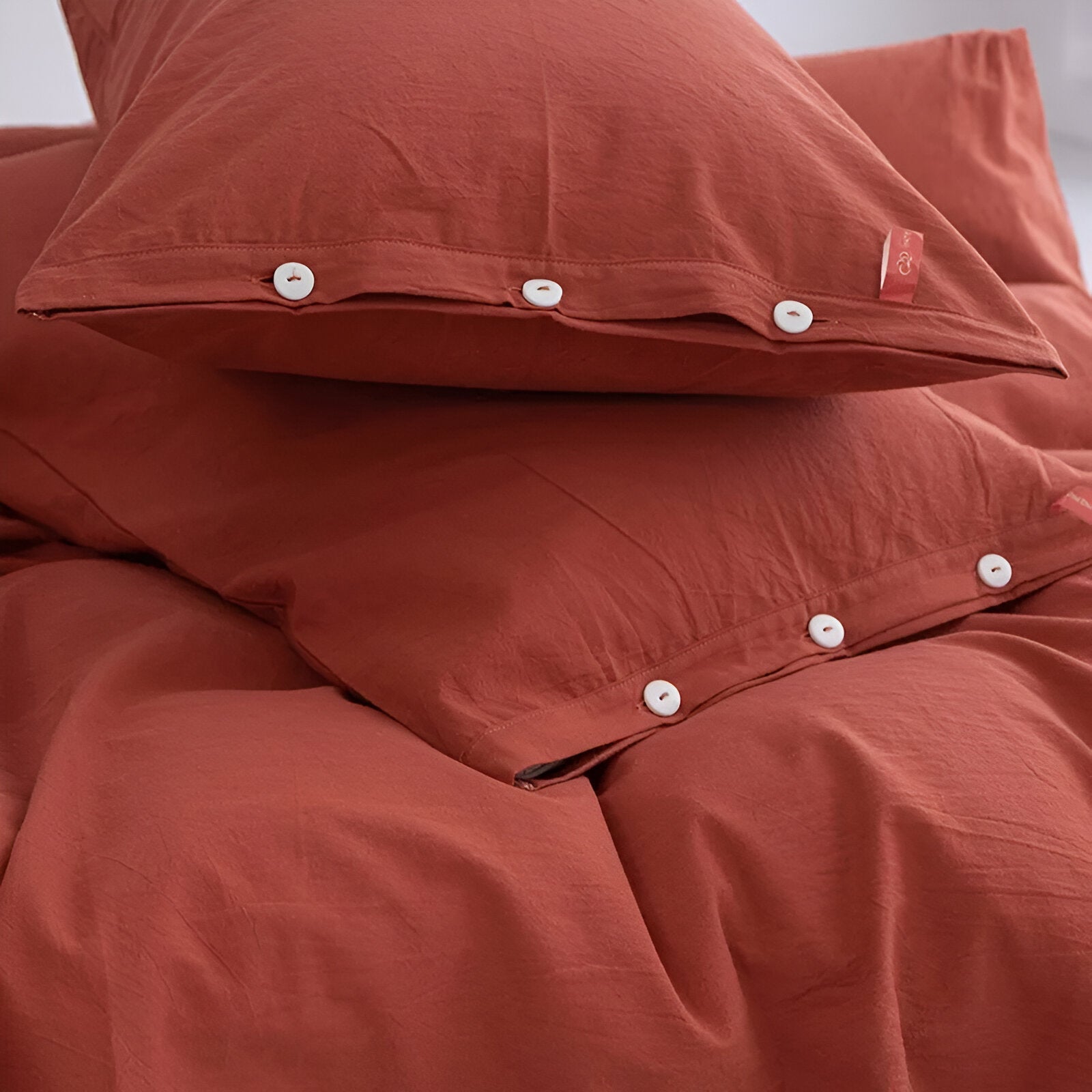 Stella Washed Cotton Bedding Set - Close Up Of Button Closure - Orange